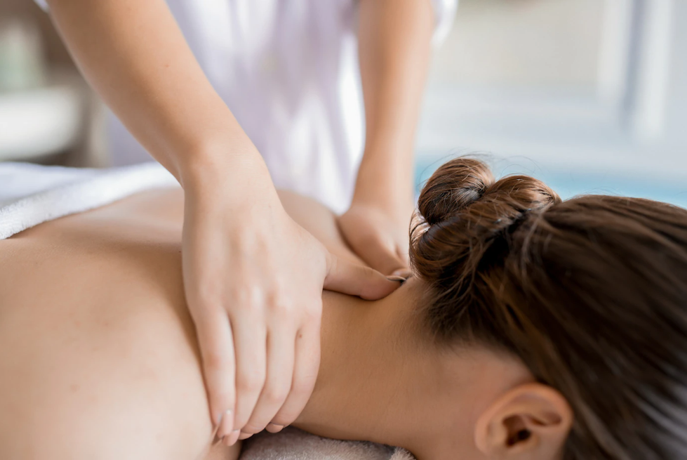 a woman having a shoulder massage