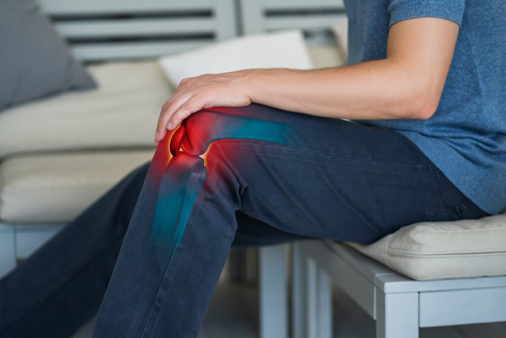 A man touch his bursitis pain