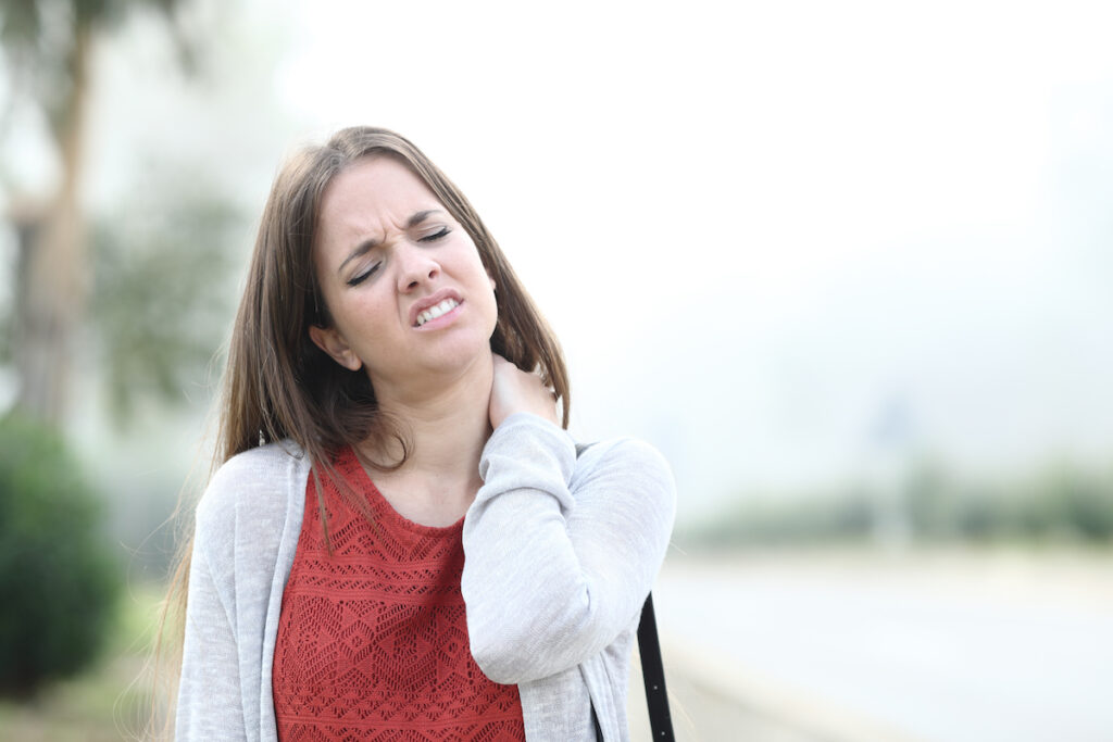 a woman suffering from fibromyalgia while walking