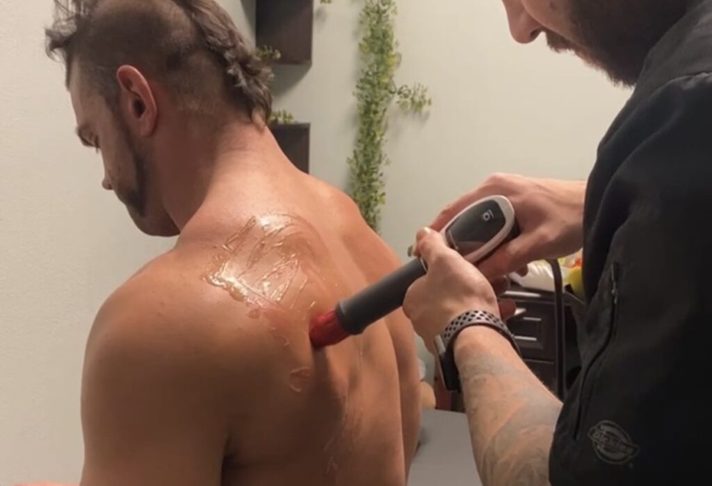 a man having back shockwave treatment