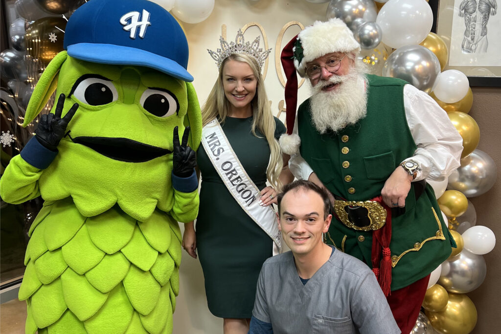 Dr. Derrick Lensgraf with Mrs. Oregon and Santa