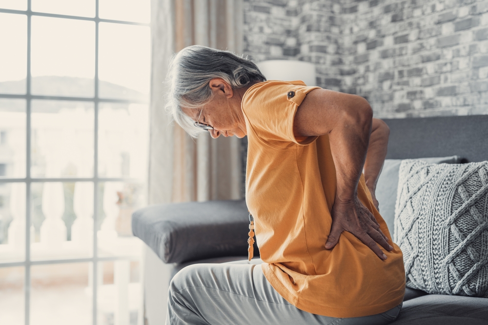 old woman suffering sciatica